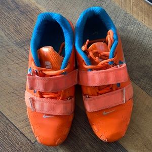 Size 5 (men’s) Nike romaleos. Orange and blue